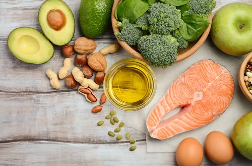 foods with healthy fats like avocados, nuts, salmon, and eggs