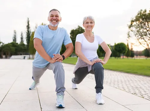 older couple stretching outdoors