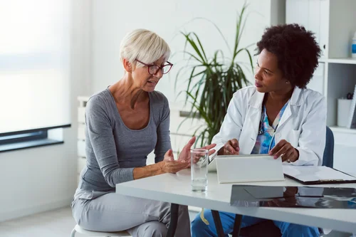 Elderly woman speaking with her dietitian