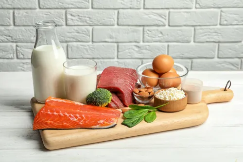 an image of milk salmon, eggs, and other protein rich foods