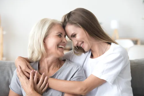 woman hugging elderly mother