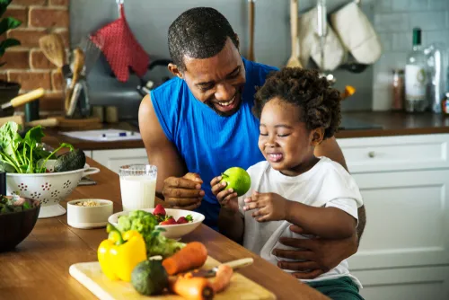 Man eating healthy with son