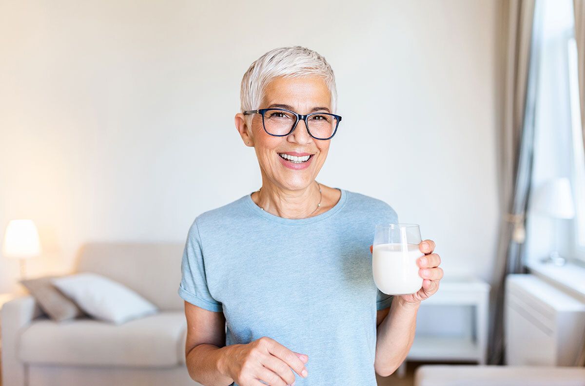 middle-aged woman drinking milk